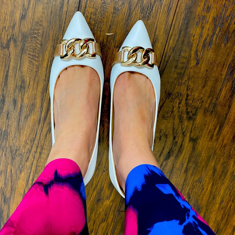 Kitten heel while and gold heels